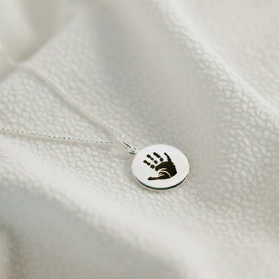 Hand and footprint pendant on a box link chain, sterling silver