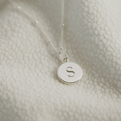 Mini initial disc pendant on a bead chain, sterling silver